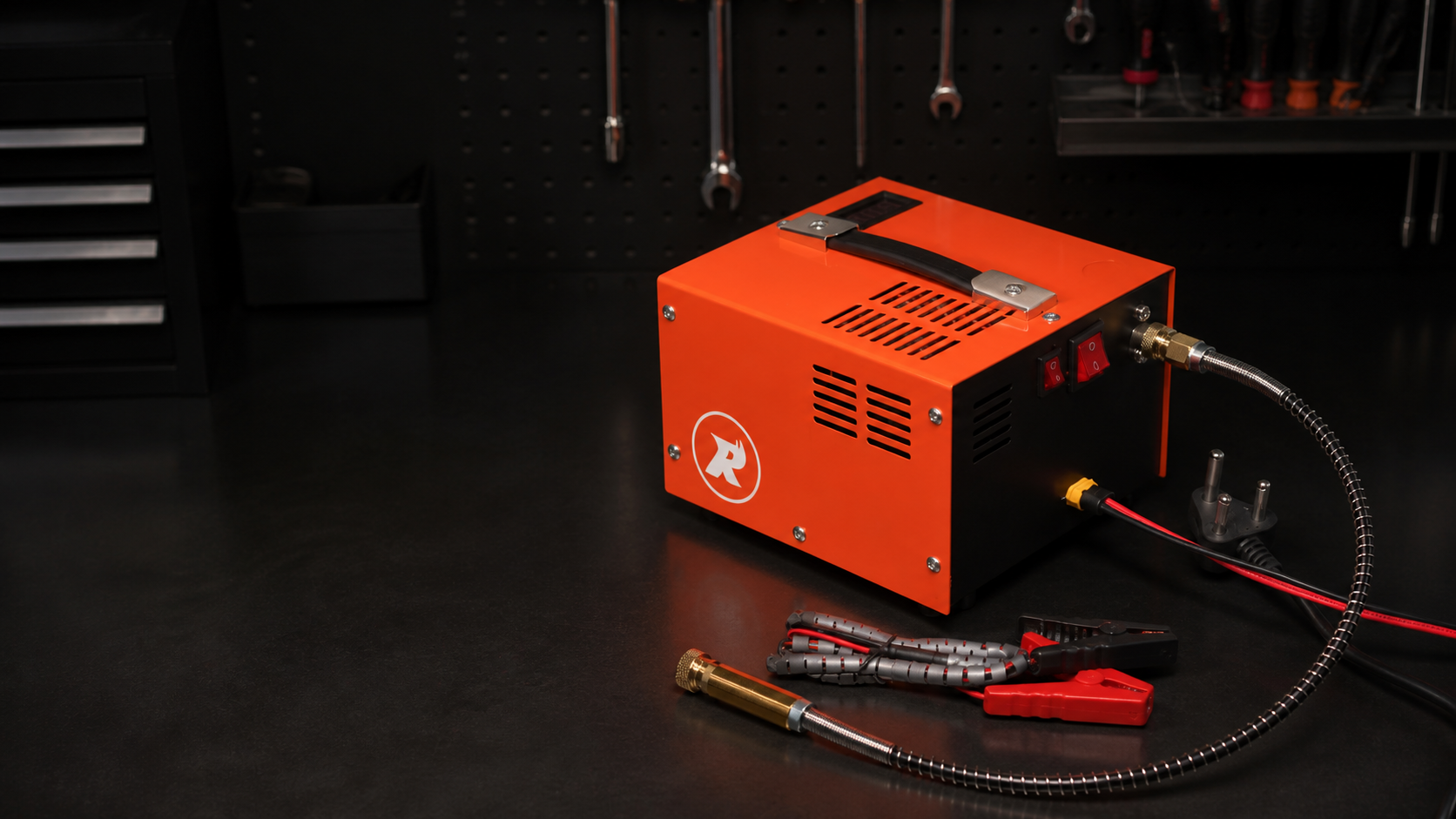 Rhino orange compact PCP compressor on a professional workshop bench